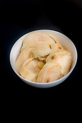 Thinly sliced ​​boiled chicken on black background