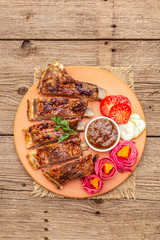 BBQ pork ribs with fermented, baked and fresh vegetables