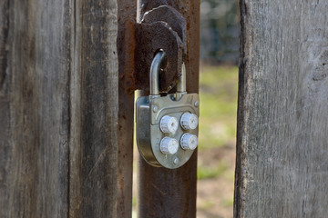 old padlock on the gate