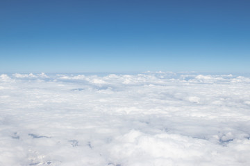 White cloud and blue sky, a view from airplane window