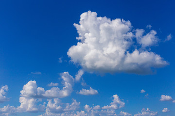 Naklejka na ściany i meble Clouds in the afternoon With a dark blue sky