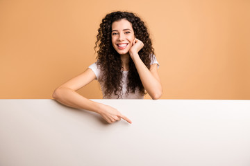 Photo of amazing lady indicating finger on empty discount banner leaning big white placard wear...