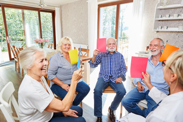 Seniors do exercise in group therapy