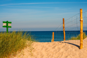 Baltic Sea in Poland, beach with beach grass and table