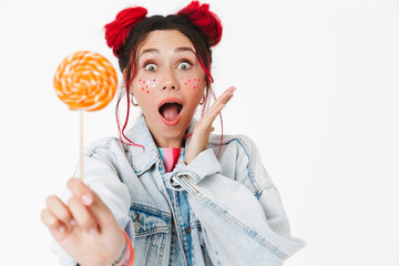 Image of delighted caucasian woman showing lollipop