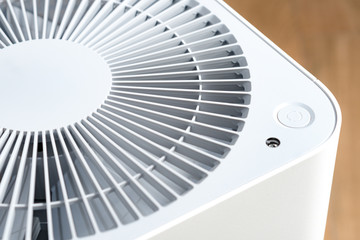 Closeup top view of Air purifier ventilation fan, a household appliance that improve air quality and prevent allergies. PM 2.5, Particulate pollution, Asthma attacks, Lung disease, Air pollutants.