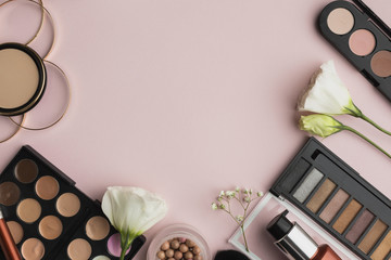 Flat lay frame with make-up products and copy-space