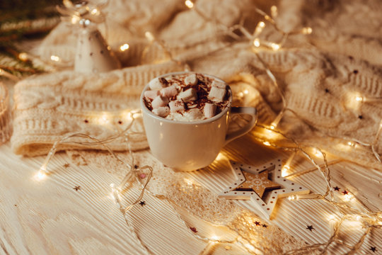 Hot chocolate with melted marshmallow Christmas Background Holiday Candy cane Warming Winter Drink Toned image Vintage style