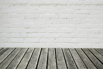 white brick wall and wood floor