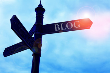 Handwriting text writing Blogquestion. Conceptual photo regularly updated website web page run by individual Road sign on the crossroads with blue cloudy sky in the background