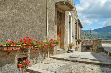 Province of Salerno, Italy, 05/27/2017. A narrow street among the old houses of a mountain village.