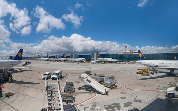 Terminal 1 with passengers airplane decking in Frankfurt