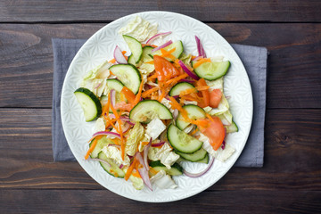 Vegetarian salad of raw fresh vegetables in a plate. Concept healthy eating Copy space