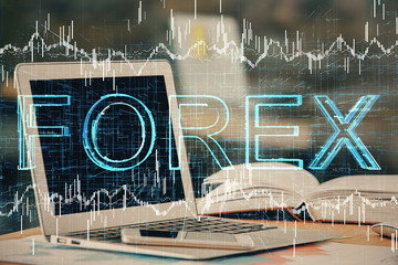 Forex graph hologram on table with computer background. Double exposure. Concept of financial markets.