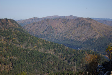 Fototapeta premium Big forest mountain valley from above. Hiking in the mountains