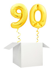 Golden number ninety inflatable balloon with golden ribbon flying out of blank white box isolated...