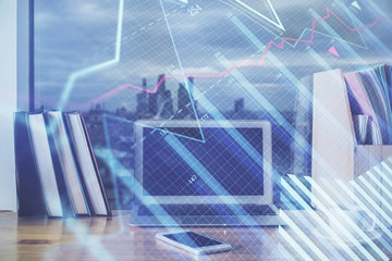 Financial chart drawing and table with computer on background. Double exposure. Concept of international markets.