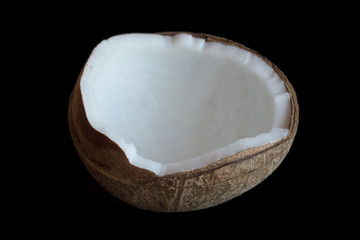 Half coconut isolate on a black background. selective focus