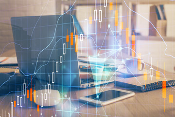 Financial graph colorful drawing and table with computer on background. Double exposure. Concept of international markets.