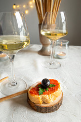 Italian aperitif with prosecco and bruschettas on a festive table