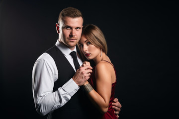 couple is ready to help each other in any situation. close up portrait, isolated black background, support concept