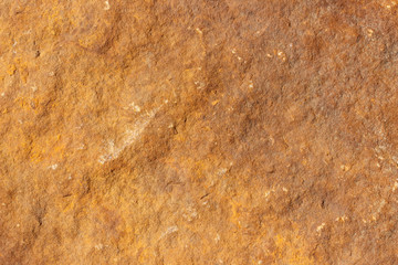 Rough surface of brown natural stone.