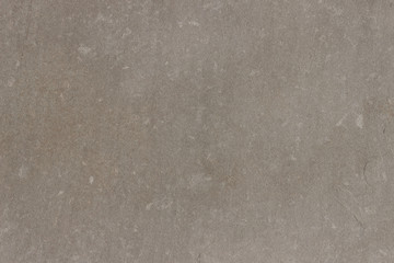 Smooth surface of a homogeneous gray natural stone.