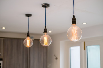 Trio of old style kitchen lamps