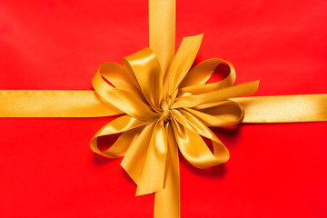 Red gift with golden bow