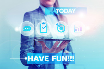 Writing note showing Have Fun. Business concept for wish somebody good and enjoyable time when they do something Female human wear formal work suit presenting smart device