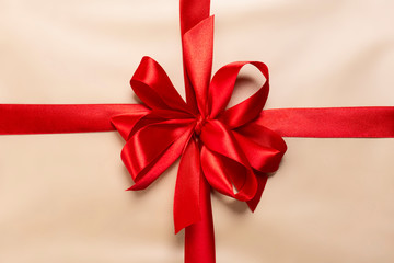 golden gift with red bow