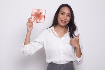 Young Asian woman thumbs up with a gift box.