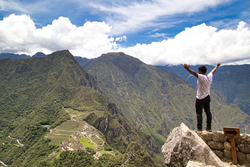 Traveller at the Lost city of the Incas, Machu Picchu,Peru on top of the mountain, with the view panoramic