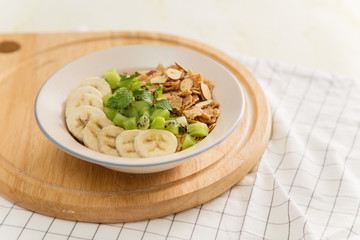 Healthy breakfast: corn flakes with milk and fresh fruits