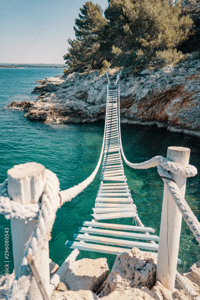 Wall mural rope bridge over a cliff in punta christo, pula, croatia - europe. travel photography, perfect for m