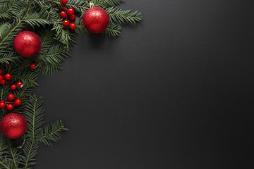 Christmas decorations on black background with copy space