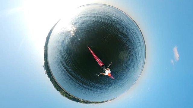 Round panorama of a person rowing along the river