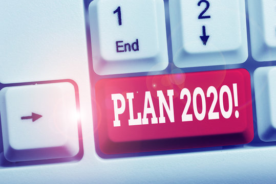 Writing note showing Plan 2020. Business concept for detailed proposal doing achieving something next year White pc keyboard with note paper above the white background