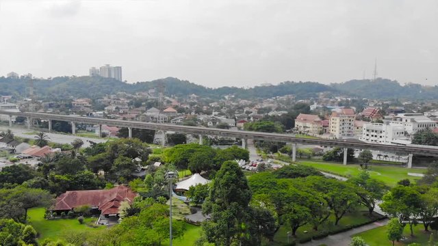 Top Aerial View Of Green Park Full With Tree Near Of Toll Road In Taman Jaya Park - Dolly Left To Right 