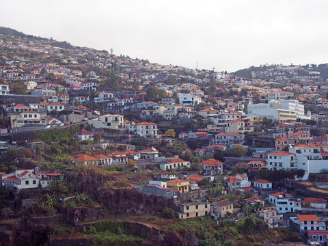 aerial view of the of houses and spread up the hillsides in funchal madeira
