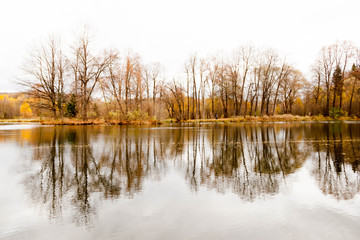 Russia, Moscow Region - October 13, 2019: Beautiful autumnal view of pond in manor Serednikovo in Firsanovka.