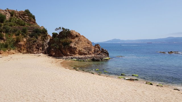 To the west of the city of Skikda on the shores of the Mediterranean Sea is the picturesque Grand Beach with yellow sand. Algeria. April 27, 2018