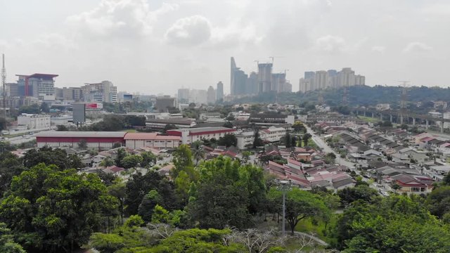 Top Aerial View Of Housing And Park Full With Tree In Taman Jaya Park - Backwards 
