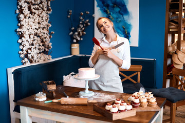 positive girl looking up, enjoying cooking process at home, household chores creative ideas for decoration