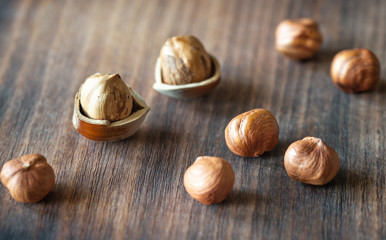 Hazelnuts on the wooden background