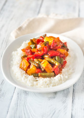Portion of white rice and fried vegetables