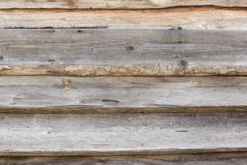 old wooden background with horizontal boards, rough rough boards nailed with large nails