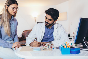 Optometrist checking patient eyesight and vision correction