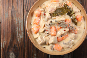 veal with cream, carrot and leaf