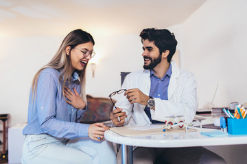 Optometrist checking patient eyesight and vision correction